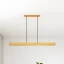 Dlouhé dřevěné závěsné svítidlo LINNA 116 cm nad jídelní stůl